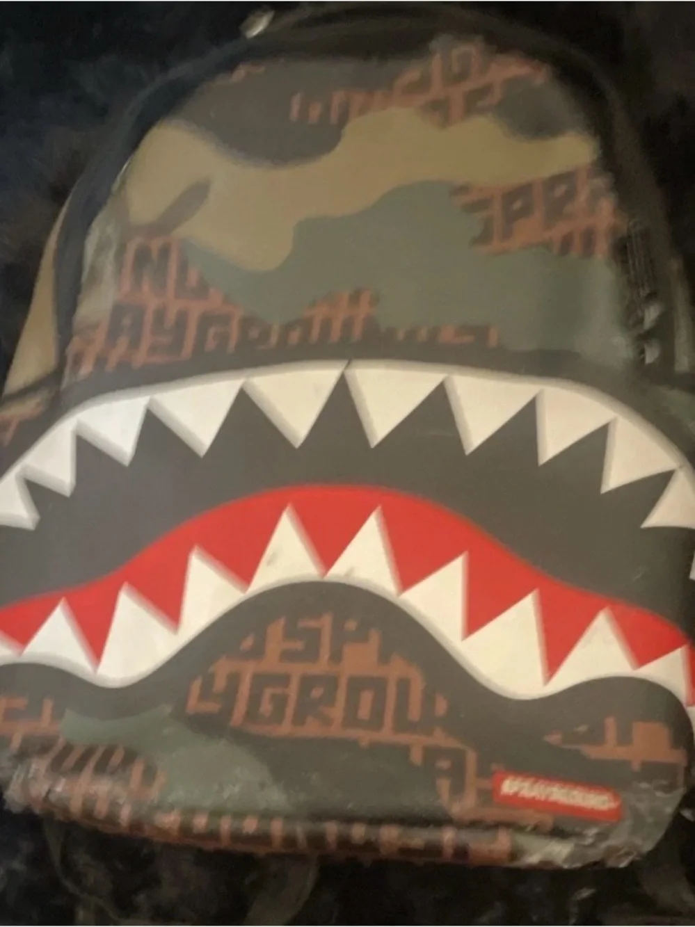 Sprayground Camo Shark Mouth Mini Backpack in Green, Red, White